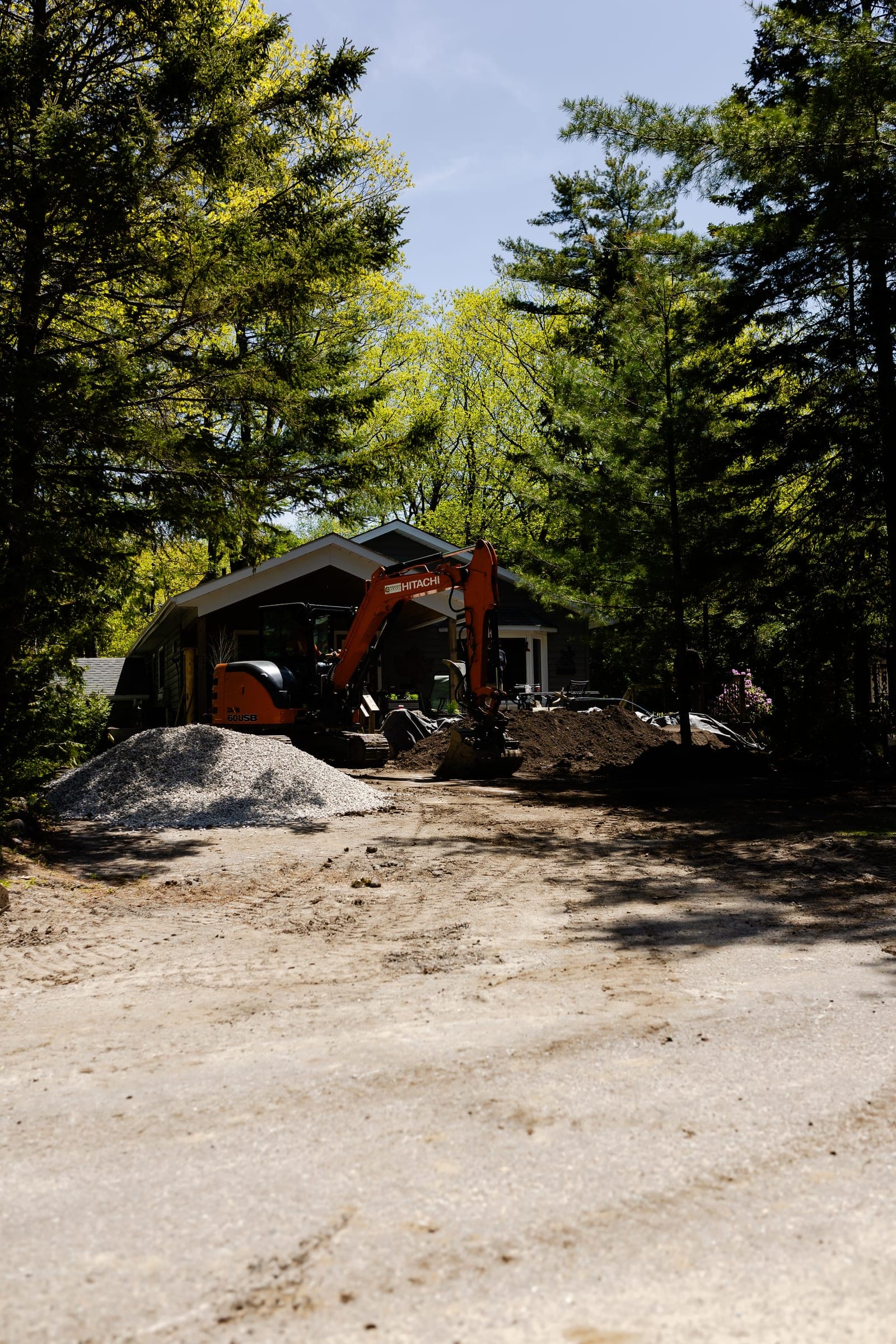 Stuart Thomas Construction — Redi-Rock retaining wall installation in South Georgian Bay — Stc 270. Materials supplied by The Sarjeant Co.